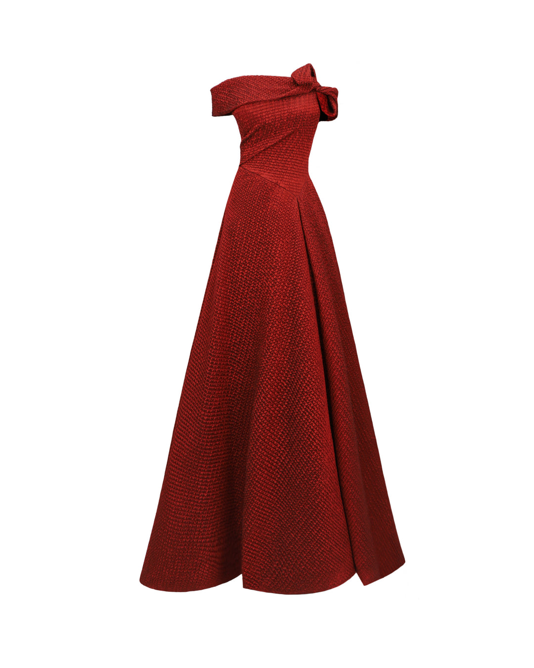 An off-the-shoulders red evening dress with an asymmetrical waistline and draped flared skirt.