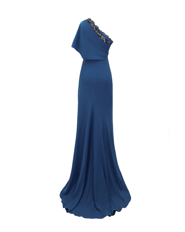 The back of a long evening dress featuring a beaded one-shoulder cut.