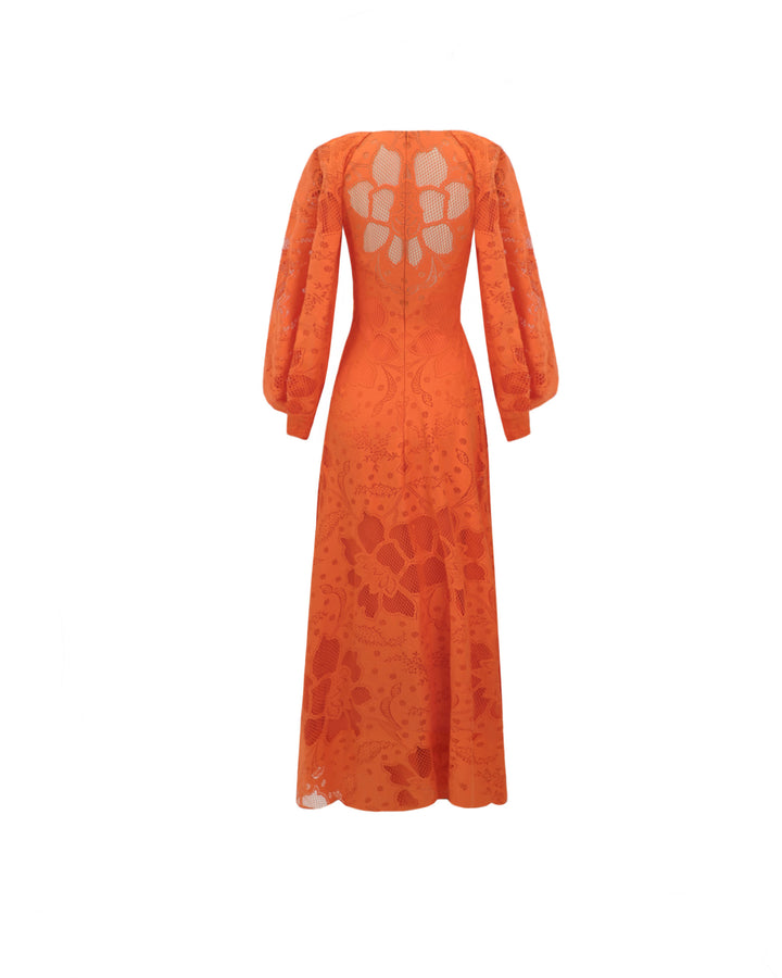 The back of an orange lace midi dress with draped bishop sleeves.