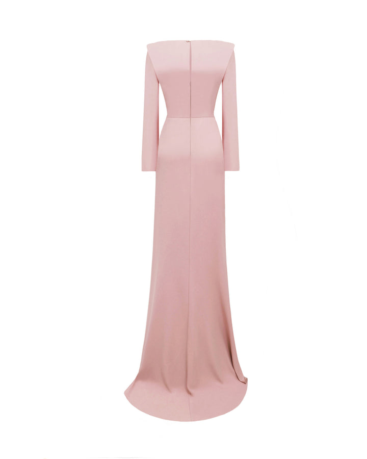 The back of a long sleeved slim-cut evening dress in pink color featuring structured shoulders, draping and floral beadings on the waist.