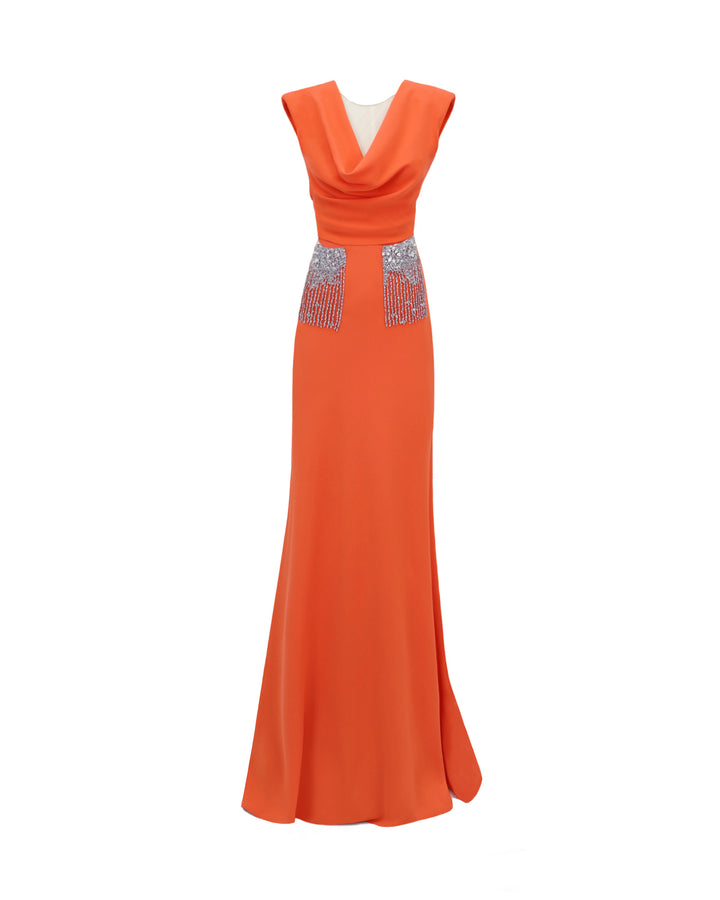 A slim-cut long orange evening dress with a draped cowl neckline and beaded pockets.