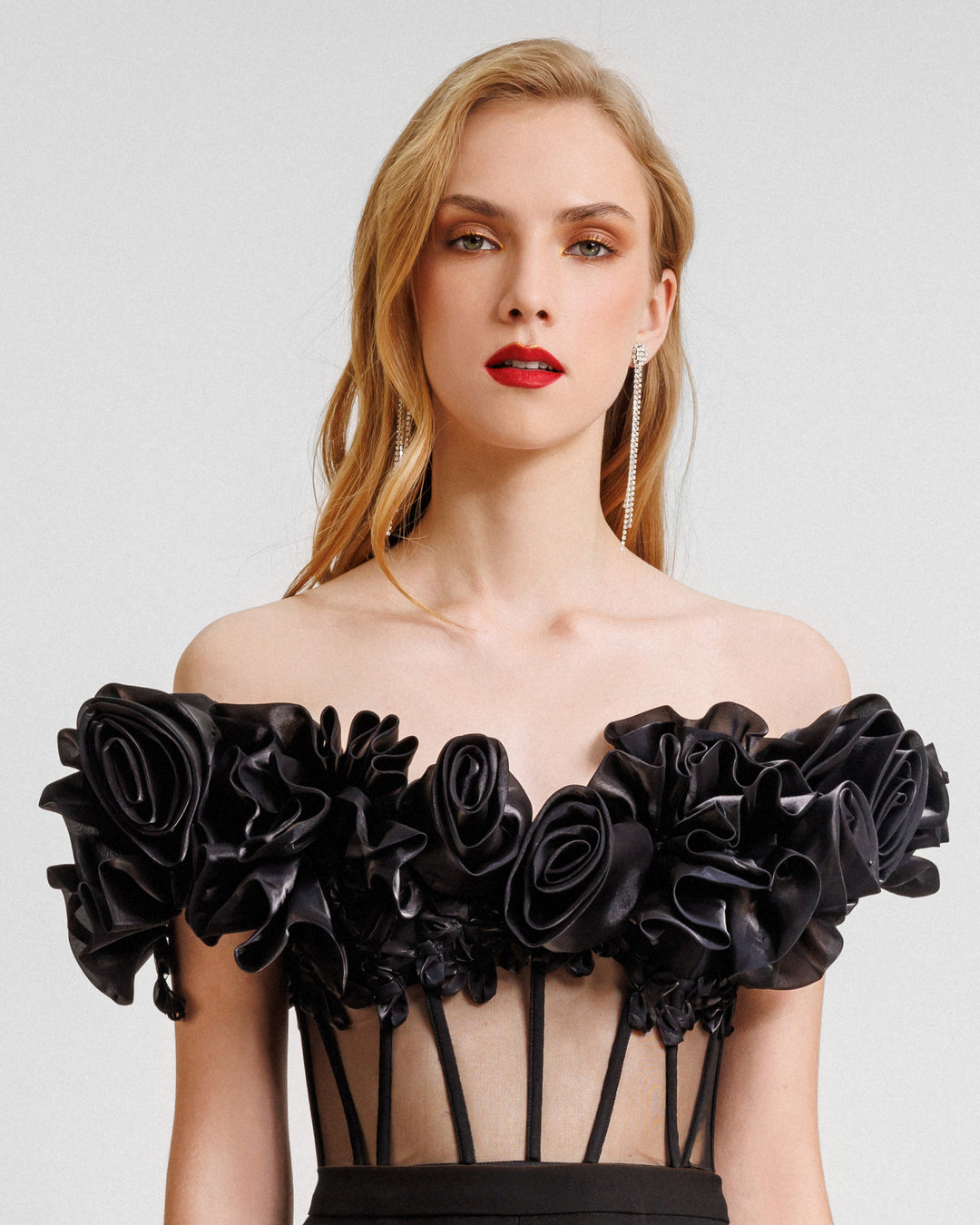 An off-the-shoulders draped floral corset with a see-though bodice.