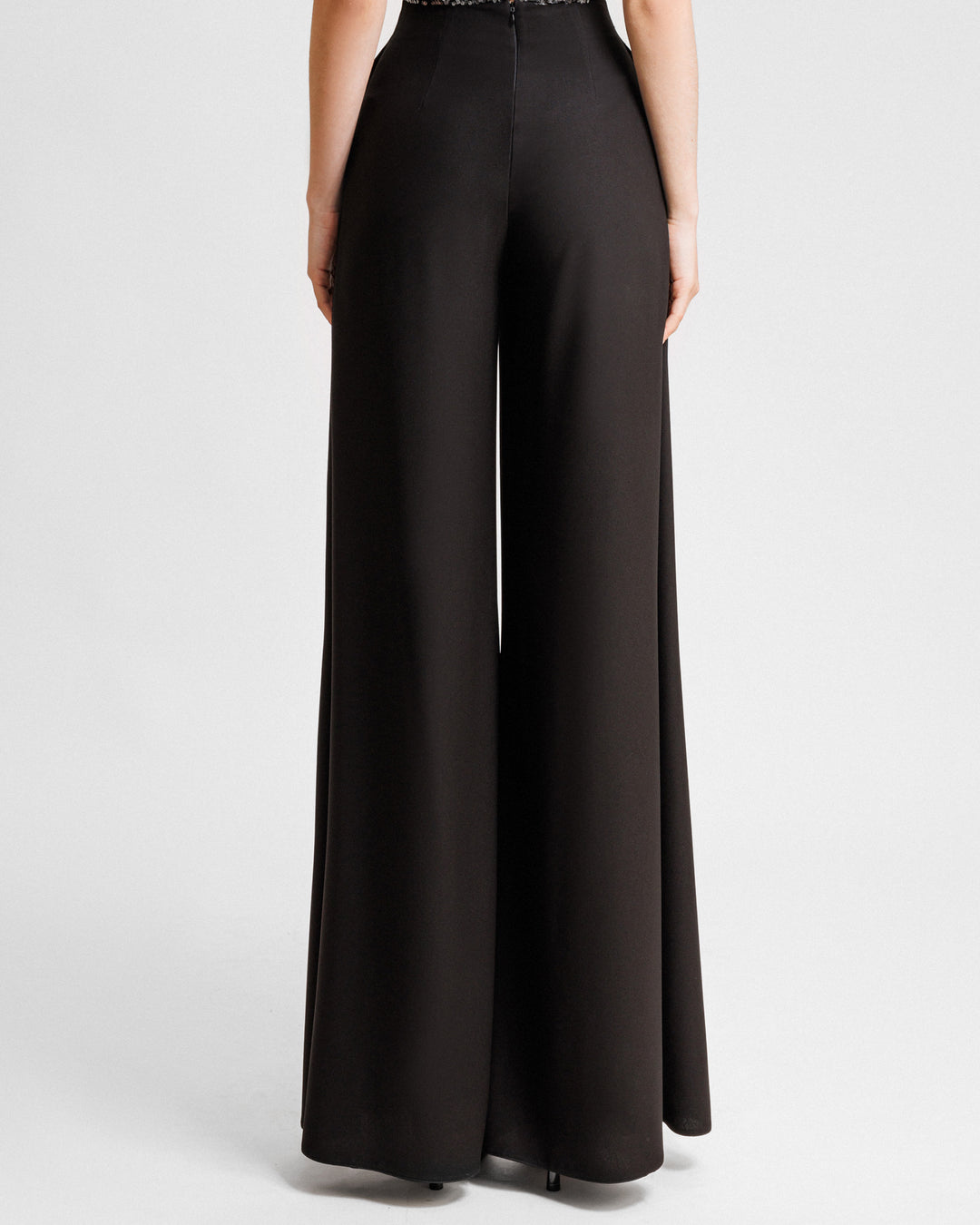 The back of a straight-cut black pants.