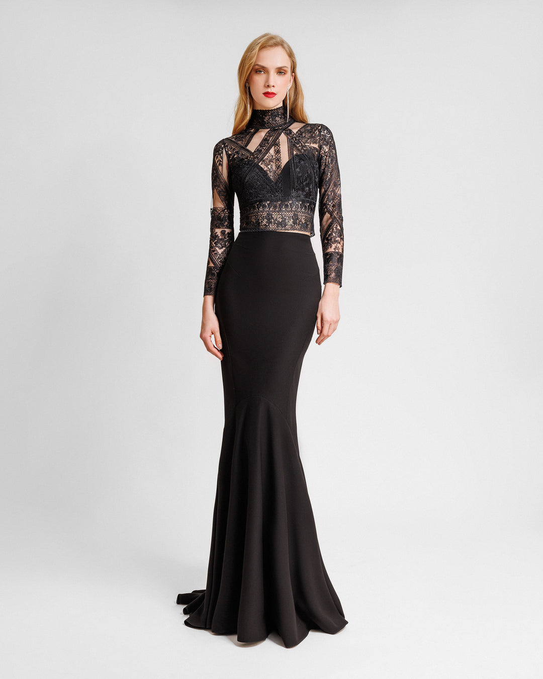 A black evening wear set featuring a long-sleeve patterned lace top paired with a long slim-cut skirt.