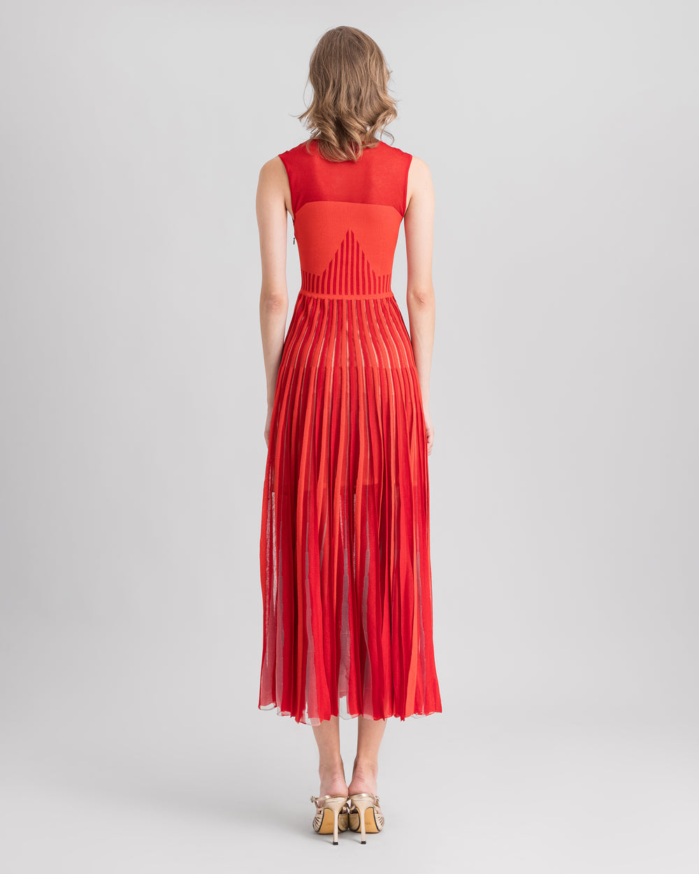 The back of a midi knit red dress.