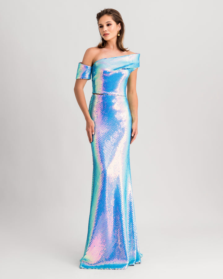 A blue sequined evening wear set featuring an asymmetrical one-shoulder draped top paired with a long slim-cut skirt.