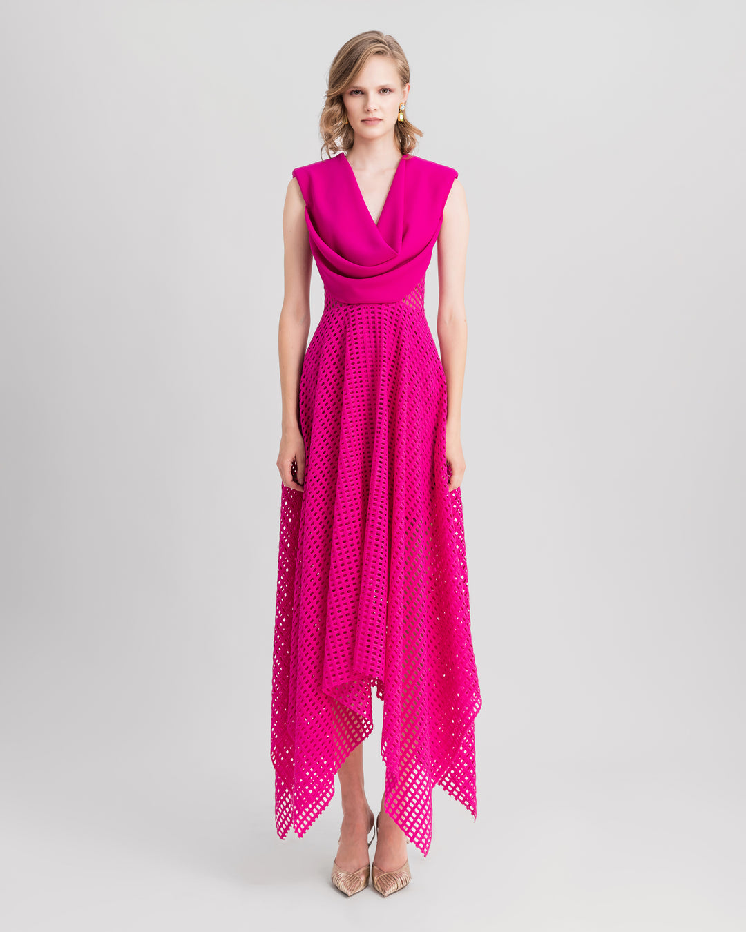 A cowl-neckline fuchsia evening midi dress with asymmetrical hemline crochet lace skirt.