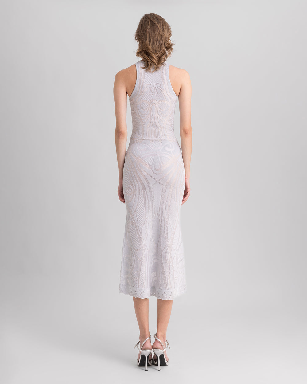 The back of a silver slim-cut patterned knit midi dress.