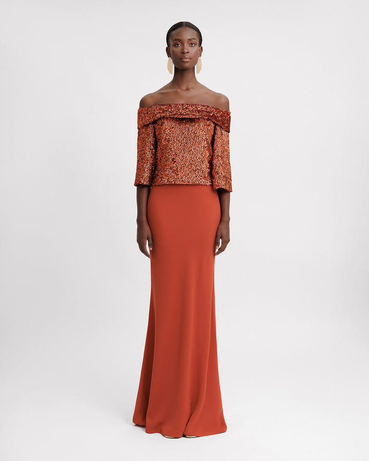 An evening wear set featuring an off-the-shoulders copper sequins top paired with a slim-cut long crepe skirt.