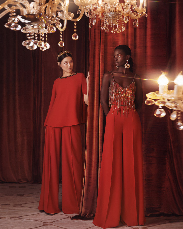 An evening wear set featuring a beaded tassels cropped top in copper paired with a flared pants.