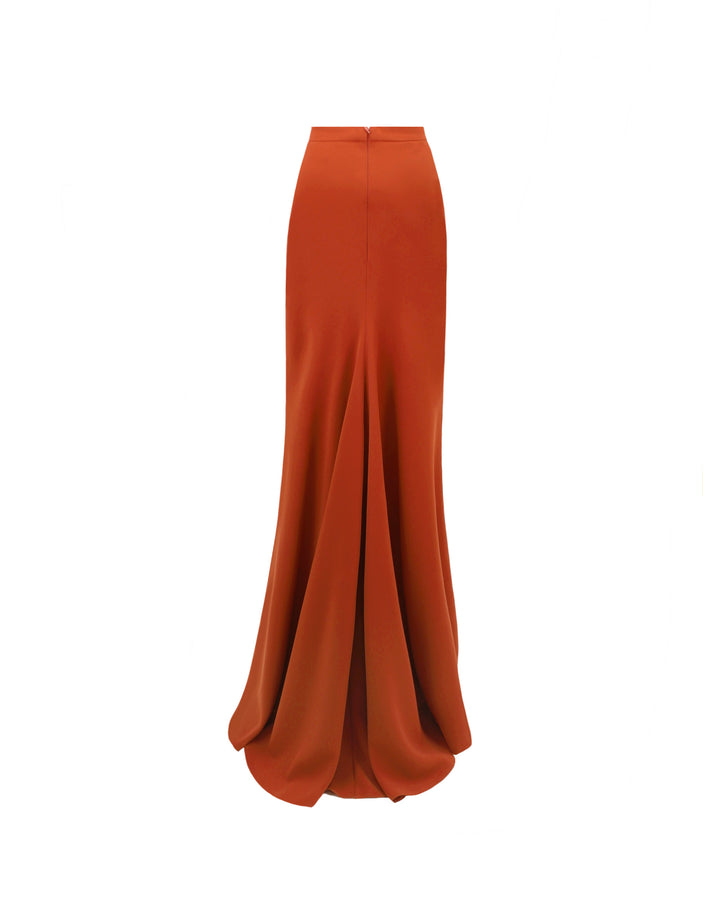 The back of an evening wear slim-cut long crepe skirt in orange color.