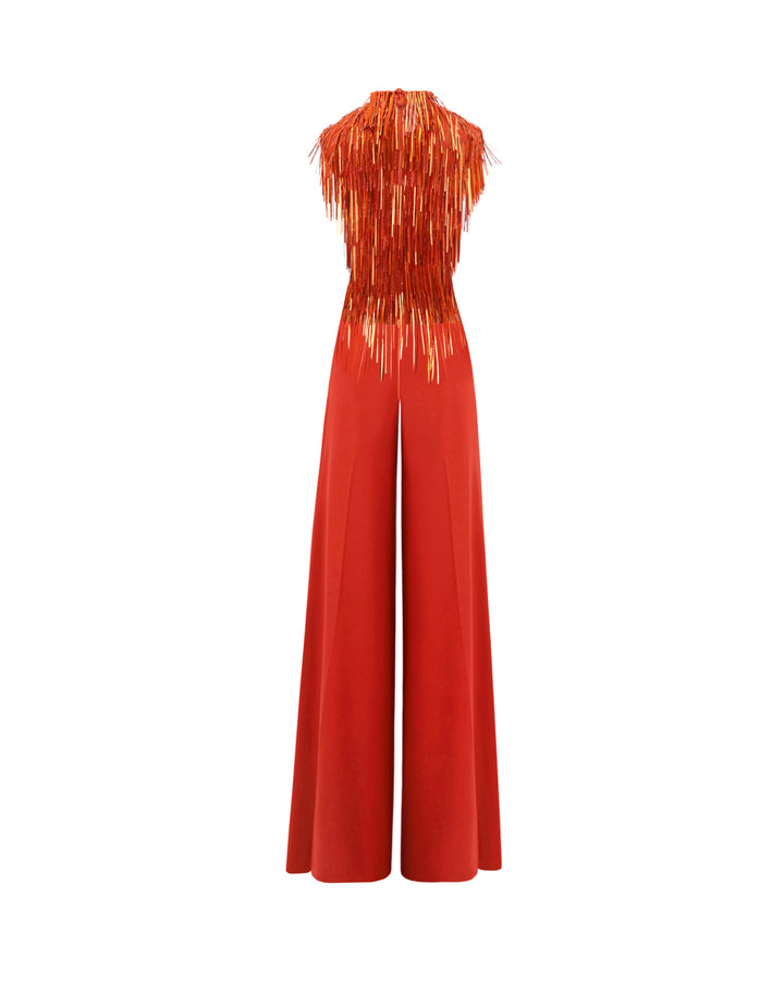 The back of an evening wear set featuring a high-collar beaded fringes top in copper color paired with flared pants.