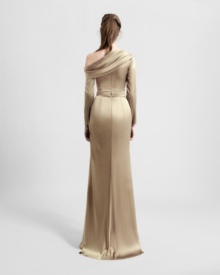 The back of a slim-cut gold satin evening dress featuring an asymmetrical draped neckline.