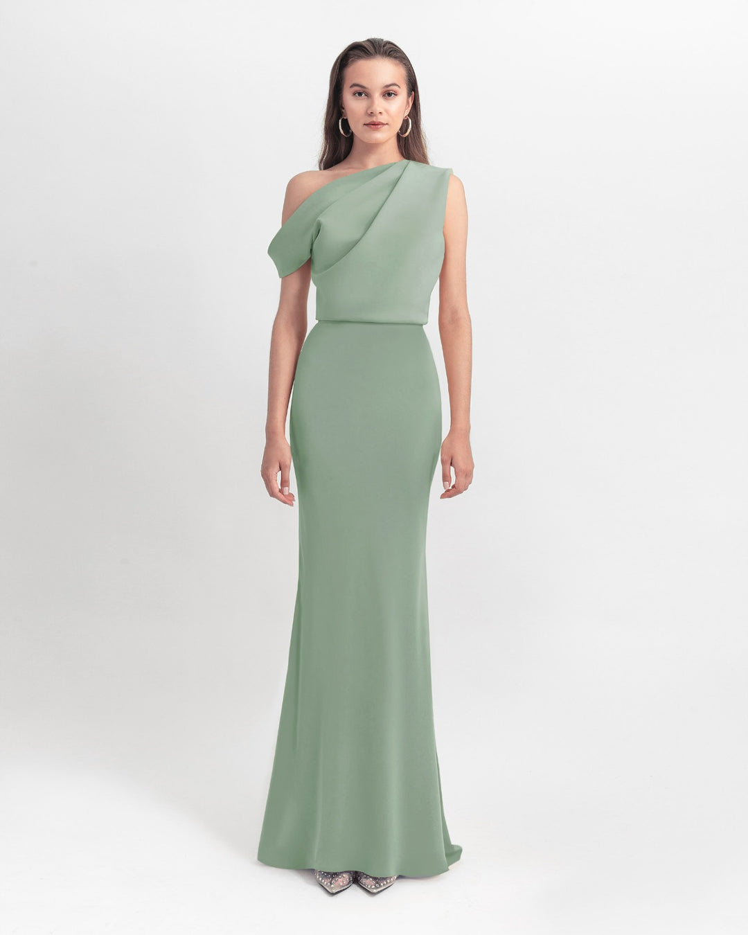 An asymmetrical cut crepe long mint green dress with draping details on the upper part and a slim cut skirt.