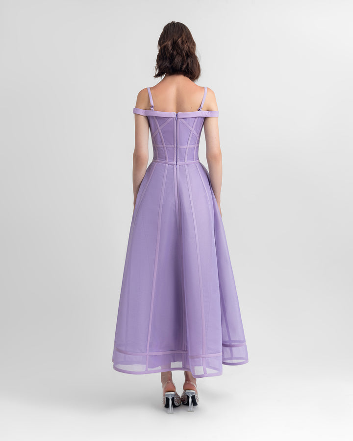 The back of a princess cut mesh midi lilac dress.