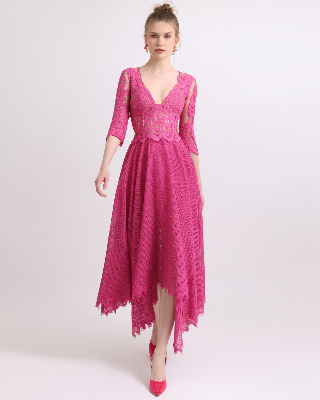 A wide V-neckline with intricate lace flared midi dress in fuchsia color.