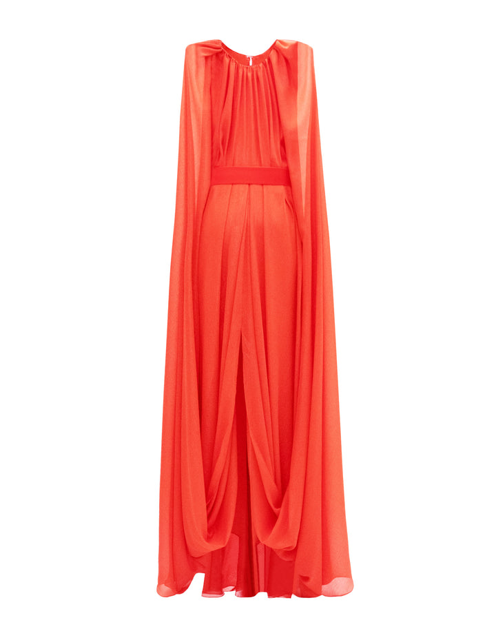 A round neckline kaftan style dress in coral color featuring an overlapped cape-like sleeves, a belt, a middle slit, and draping details.