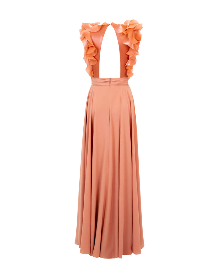 The back of a flowy crepe copper evening dress featuring an upside down v-shape open back and ruffle details on the upper sides.