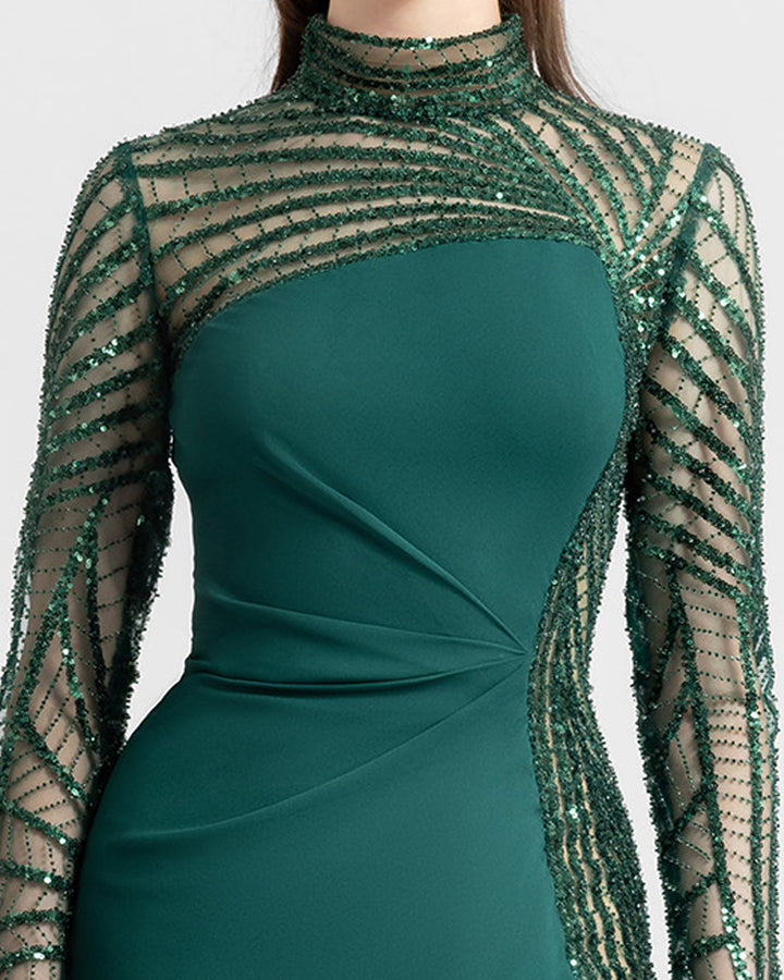 A close-up of a slim-cut crepe green evening dress featuring see-through and embroidered sleeves and back.