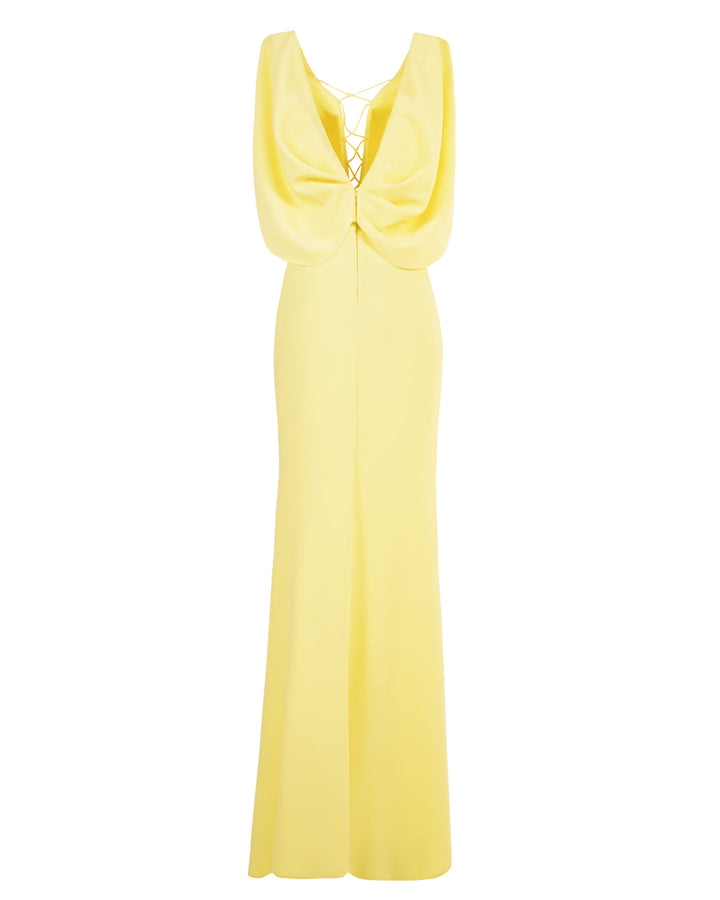 A v-shape long yellow evening dress with cape-like sleeves.