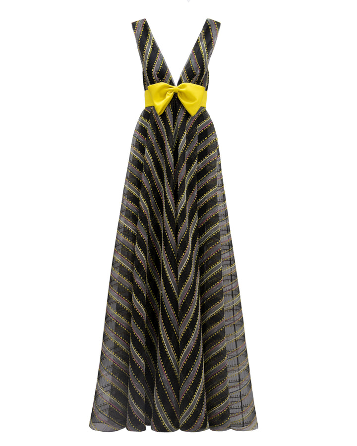 A deep V-neckline flared evening dress with a yellow bow-like design in the middle.