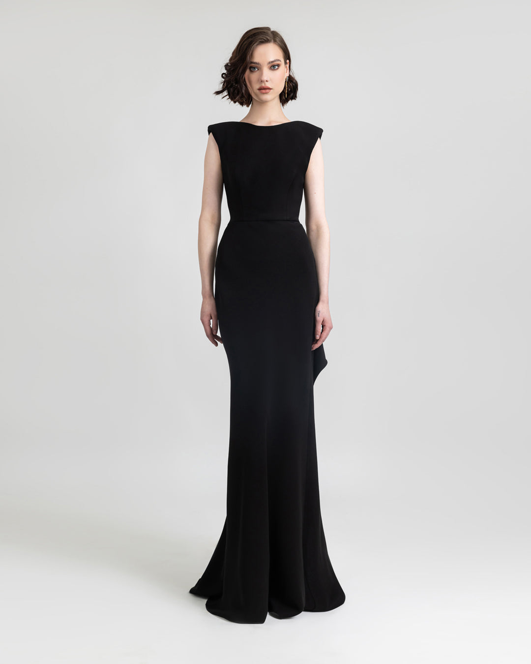 A slim cut black evening dress.