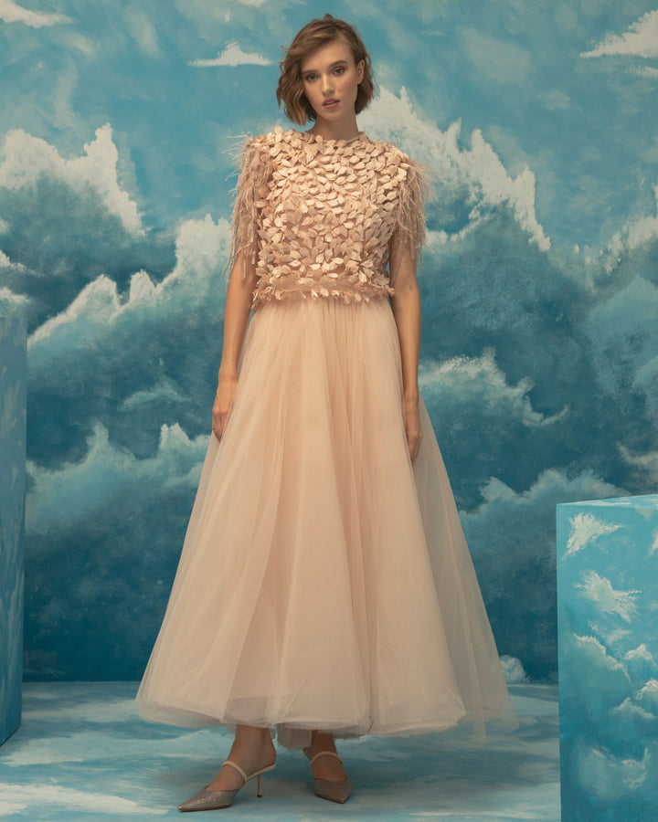 An evening wear set featuring a fully embellished folded satin on tulle top paired with a pink A-cut tulle midi skirt.