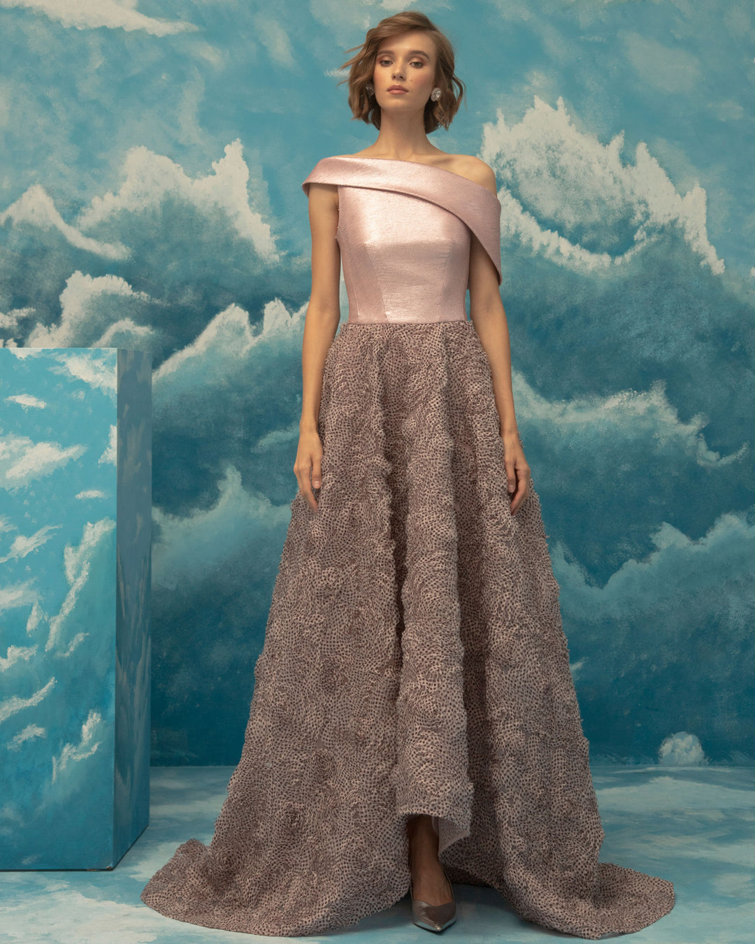 A bi-fabric evening dress, asymmetrical woven metallic fabric upper part and wide fluffy textured chiffon cut skirt.