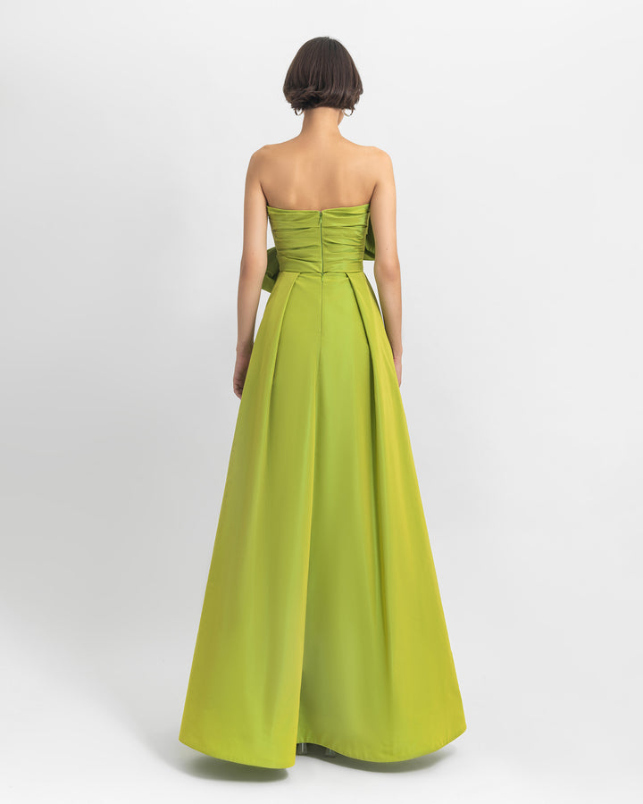 The back of a strapless green Tafta evening dress with a wide skirt.