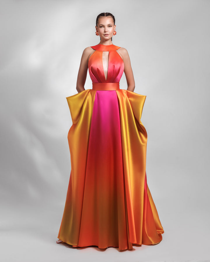 A deep V-neckline long heavy satin evening dress in orange, yellow, and fuchsia hues, with pleating details and symmetrical draped details on the side.