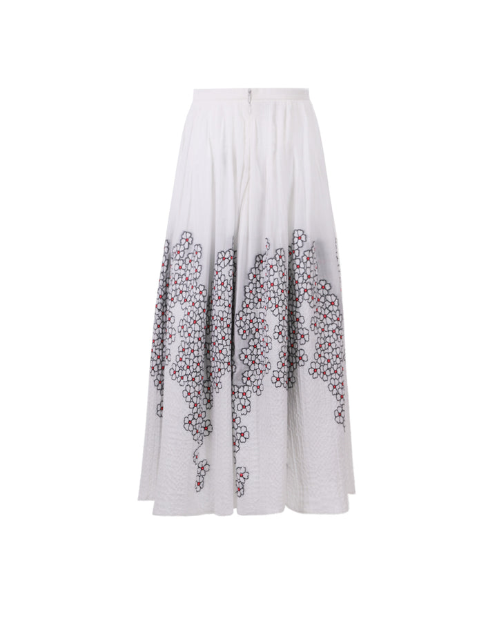 The back of a white jacquard midi flared skirt with flower motifs.