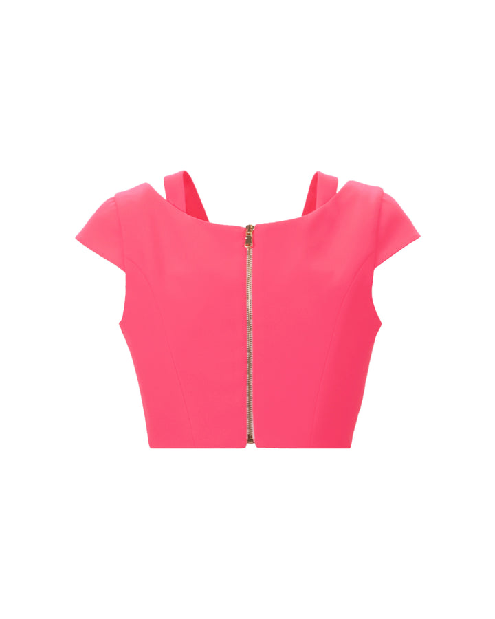 The back of a pink cropped top with cut out details.