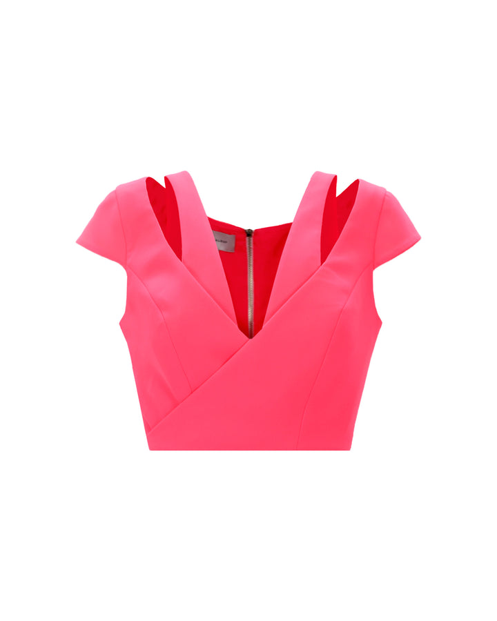 A pink cropped top with cut out details.