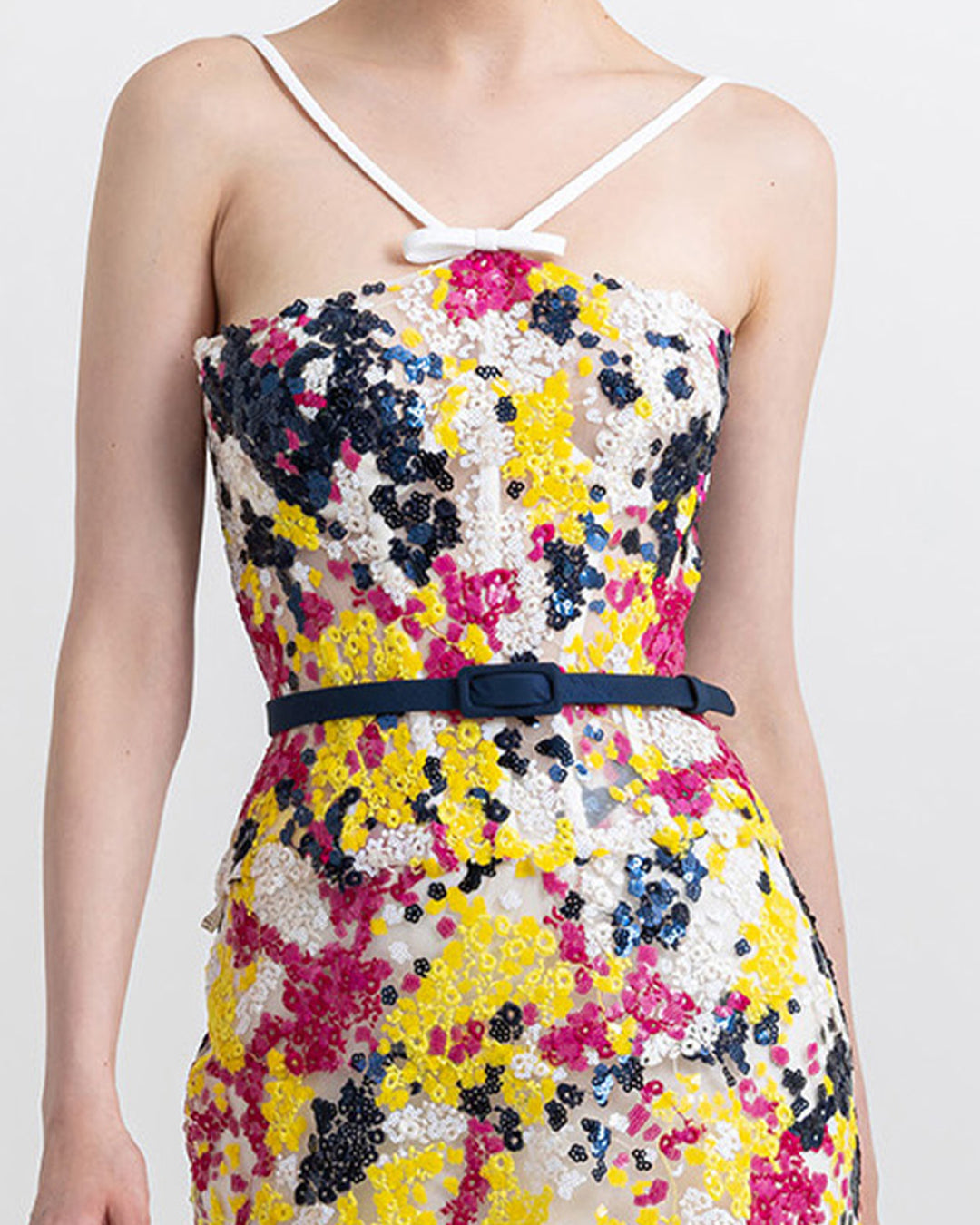 A close-up of a multicolor sequins corset midi flared dress comes with a navy belt.