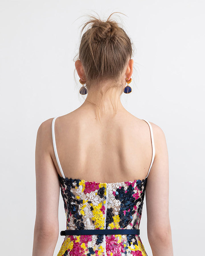 The back of a multicolor sequins corset.