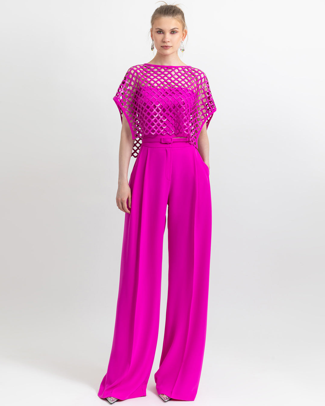 Strapless bustier with a detachable sequins fuchsia top paired with straight cut crepe pants with detachable belt.