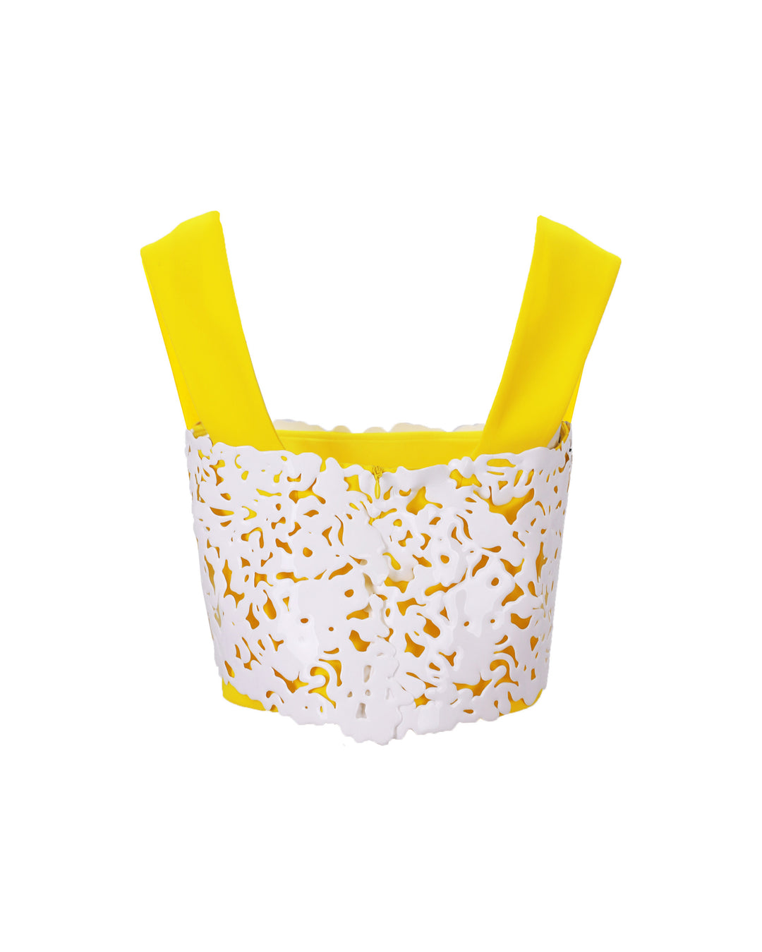 The back of a yellow cropped crepe top with white laser-cut silicon.