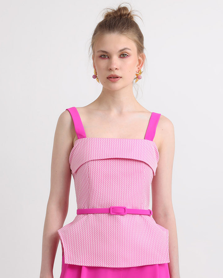 An asymmetrical two tone pink top with detachable belt.