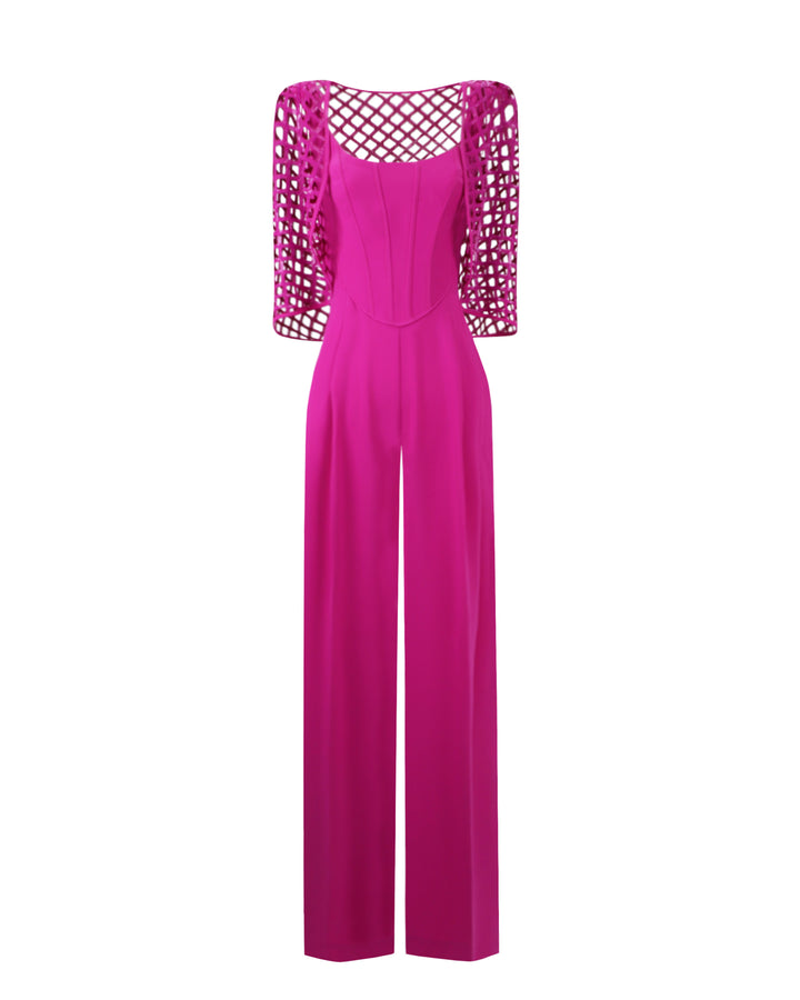 An evening wear look featuring a corset jumpsuit paired with a detachable sequined cape all in fuchsia color.