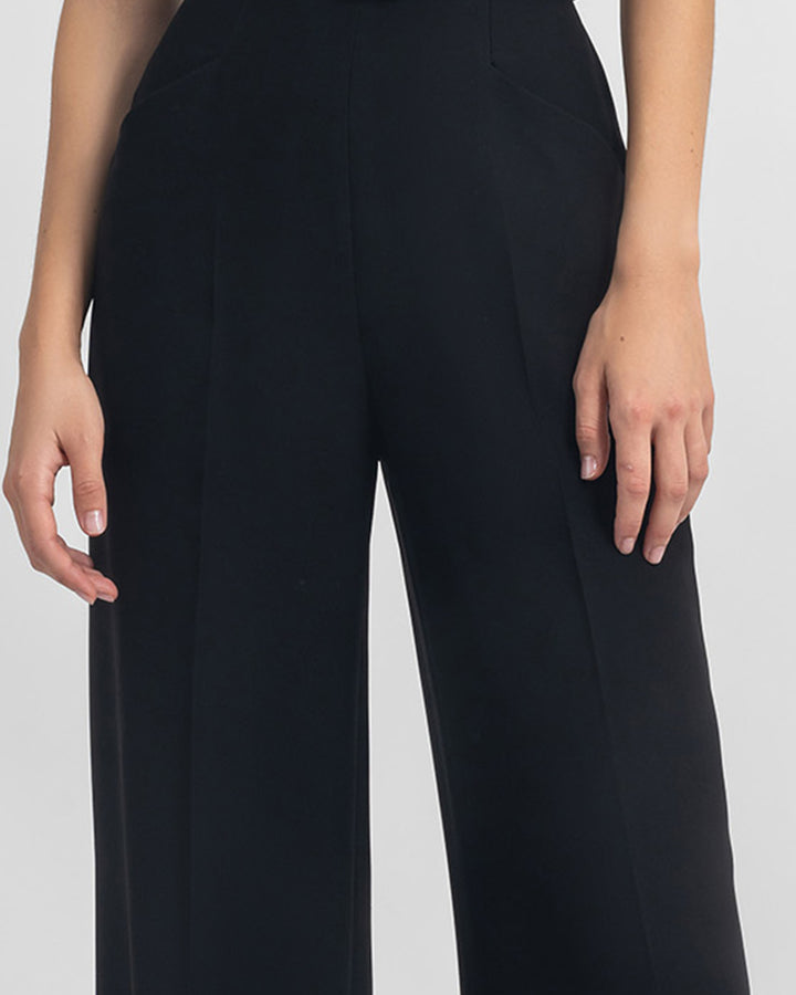 A close-up of a straight-cut crepe black pants with a detachable belt.