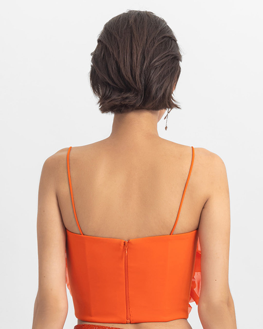 The back of an orange cropped top.