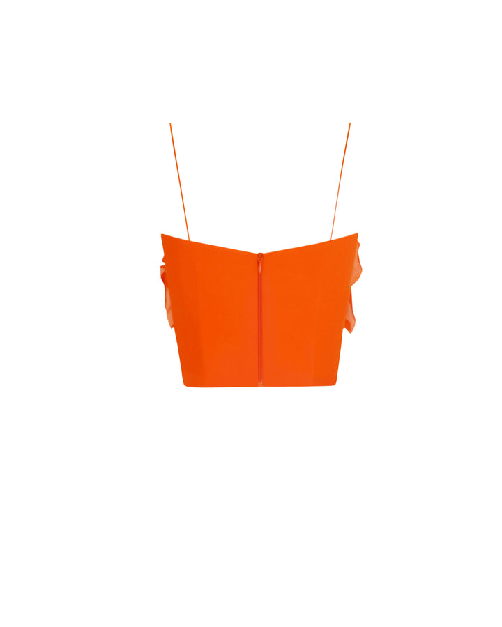 The back of an orange cropped top.