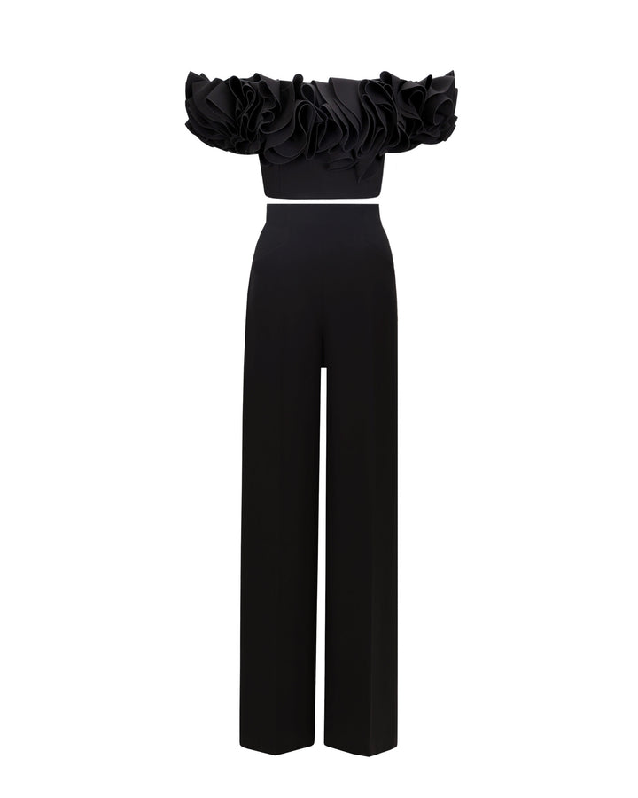 A black evening wear set featuring an off-shoulder ruffled crepe top, paired with straight cut crepe pants and a detachable belt.