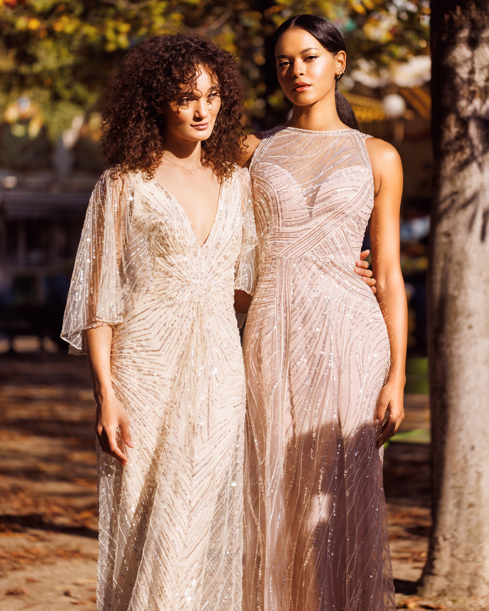 A heart shape corset long pink dress overlayed with sequin fabric and draping details.